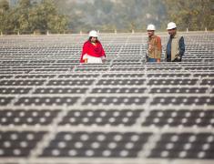 Workers at a 1 MW solar power station Delhi, India. 